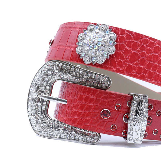 Red rhinestone belt with engraved flower buckle and studded strap