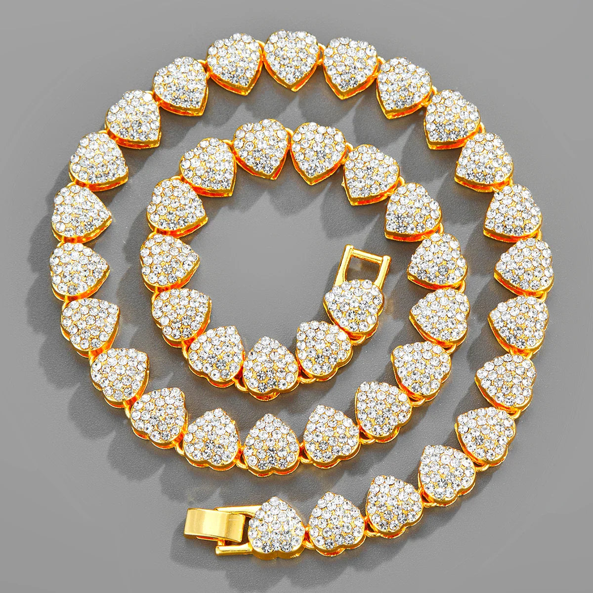 Iced out Cuban link chain featuring heart shaped charm