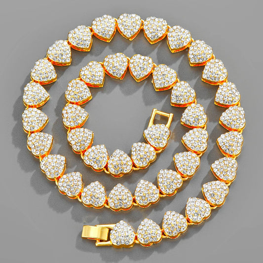 Iced out Cuban link chain featuring heart shaped charm