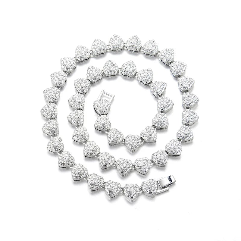 Iced out Cuban link chain featuring heart shaped charm